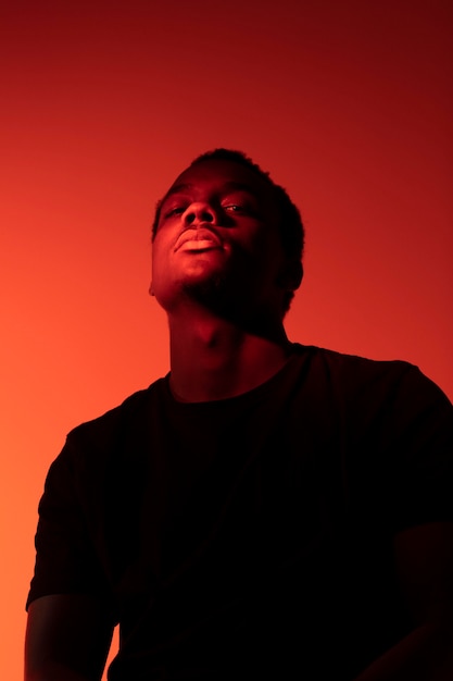 Portrait of handsome man over orange background