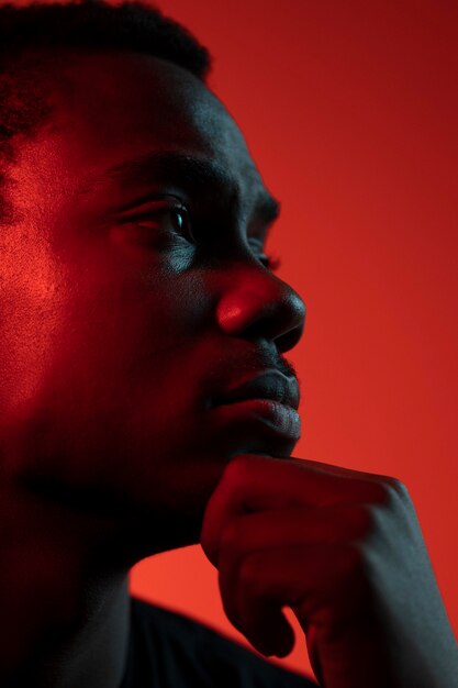 Portrait of handsome man over orange background