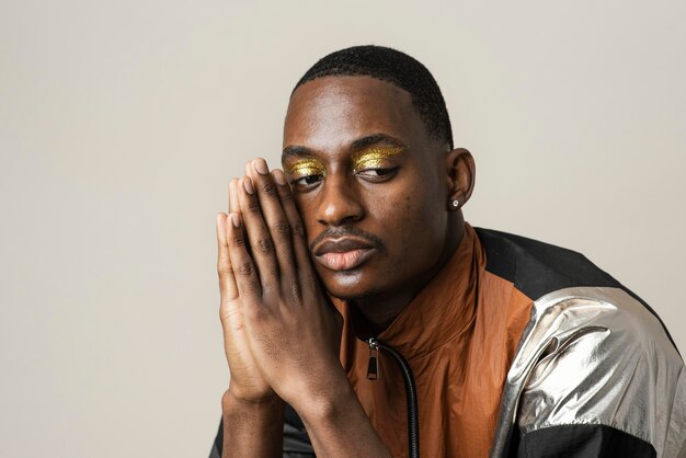 Portrait of handsome man wearing make-up