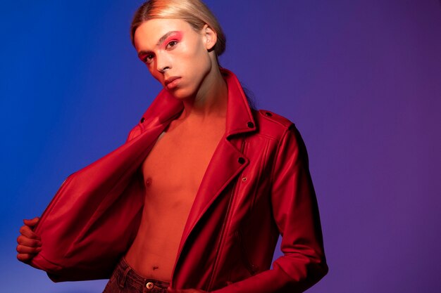 Portrait of handsome man with long blonde hair wearing a red jacket