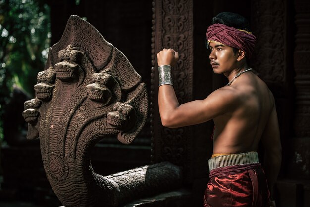 Portrait Handsome shirtless man in turban on head and beautiful silver ornament