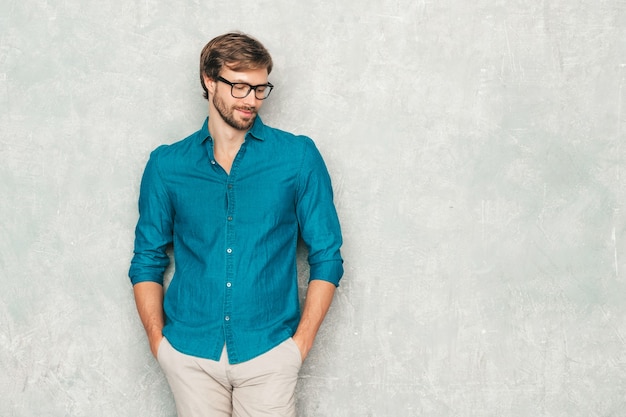 Portrait of handsome smiling hipster lumbersexual businessman model wearing casual jeans shirt clothes. 