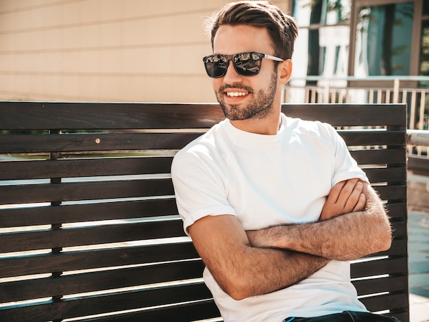 Portrait of handsome smiling stylish hipster lambersexual model