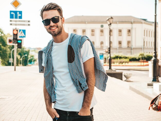 Portrait of handsome smiling stylish hipster lambersexual model