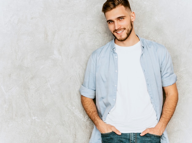 Portrait of handsome smiling young man model wearing casual shirt clothes. fashion stylish man posing