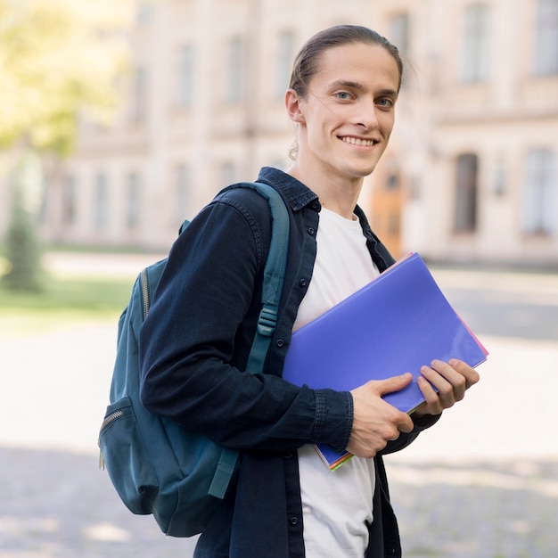 Portrait of handsome student at campus