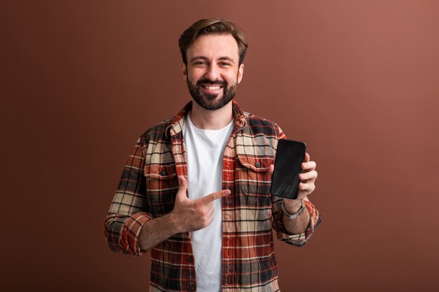 Portrait of handsome stylish bearded man on brown