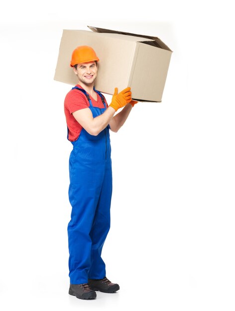 Portrait of handsome young delivery man with paper boxes isolated on white