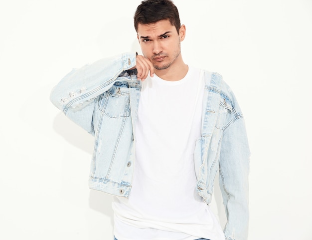 Free photo portrait of handsome young model man dressed in jeans clothes posing. isolated