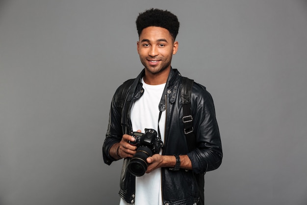 Portrait of a happy afro american guy in leather jacket