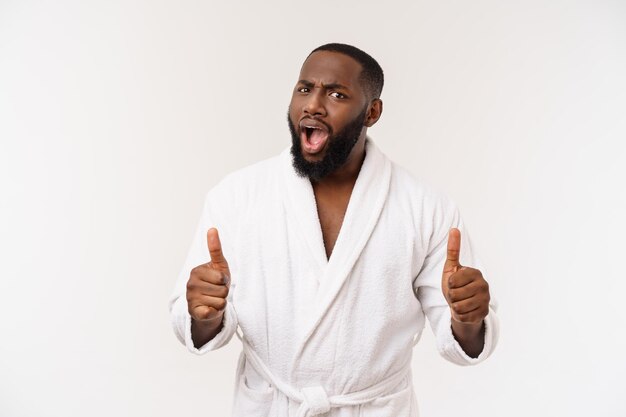 Portrait of happy afroamerican handsome bearded man laughing and showing thumb up gesture