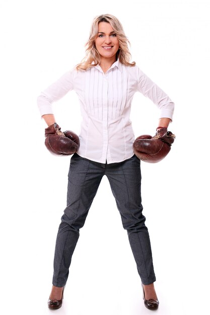 Portrait of happy aged woman with boxing gloves