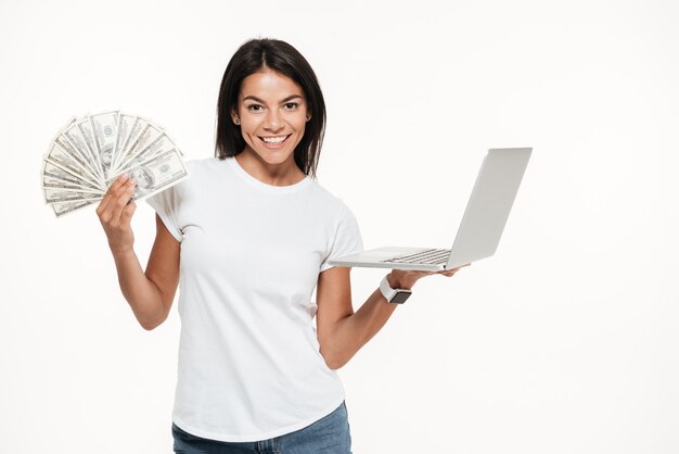 Free photo portrait of a happy attractive woman holding laptop computer