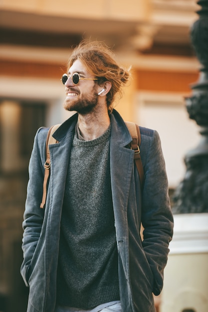 portrait of a happy bearded man wearing sunglasses