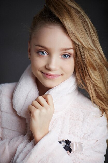 Portrait of happy blond  little girl.