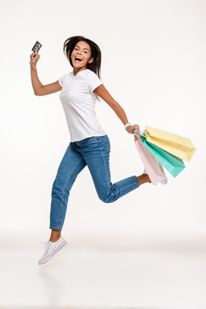 Portrait of a happy casual woman jumping