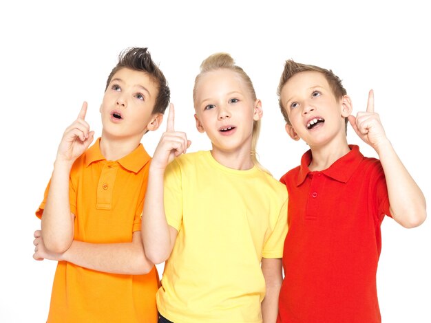 Portrait of the happy children point up with idea sign -  isolated on white