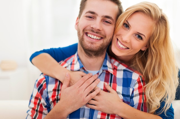 Portrait of happy embraced couple