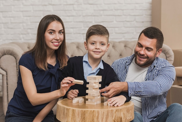 Portrait of happy family playing a game