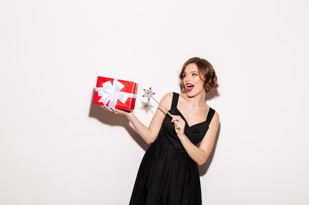 Portrait of a happy girl dressed in black dress