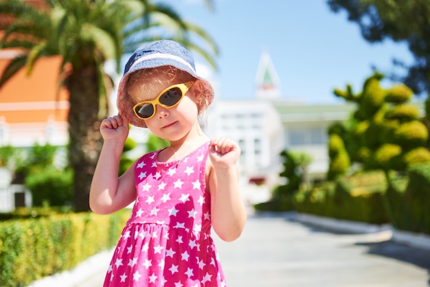 Portrait of a happy girl outdoors in summer day.