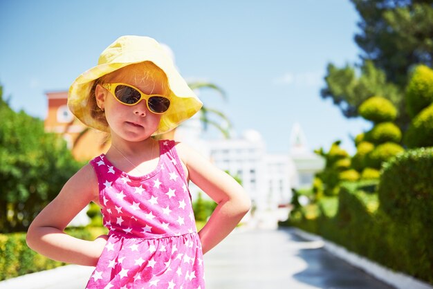 Portrait of a happy girl outdoors in summer day.