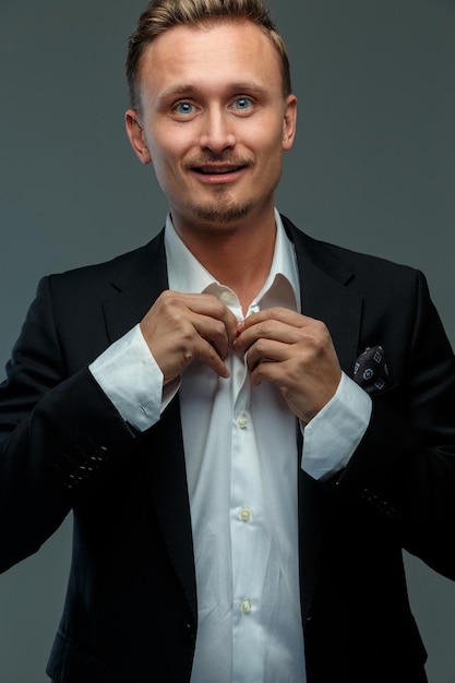 Portrait of happy, handsome business man in a suit.