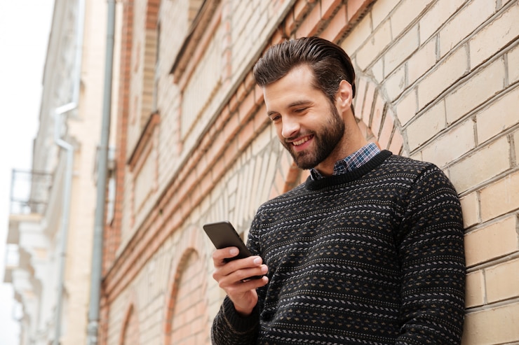 Free Photo portrait of a happy handsome man in sweater