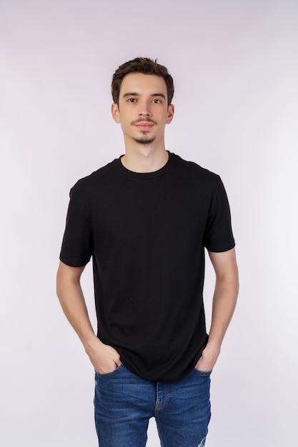 Portrait of happy handsome young man posing on isolated background