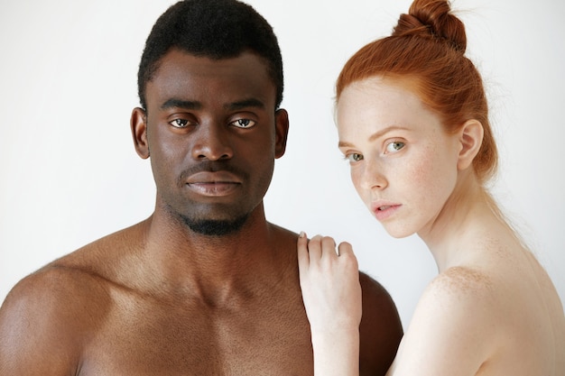 Free photo portrait of happy loving interracial couple