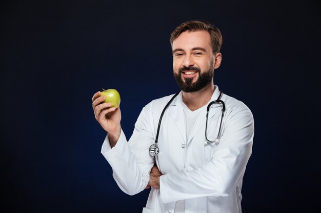 Portrait of a happy male doctor dressed in uniform