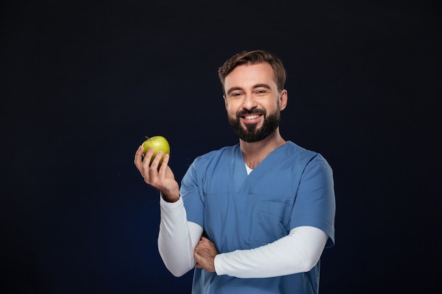 Portrait of a happy male doctor dressed in uniform