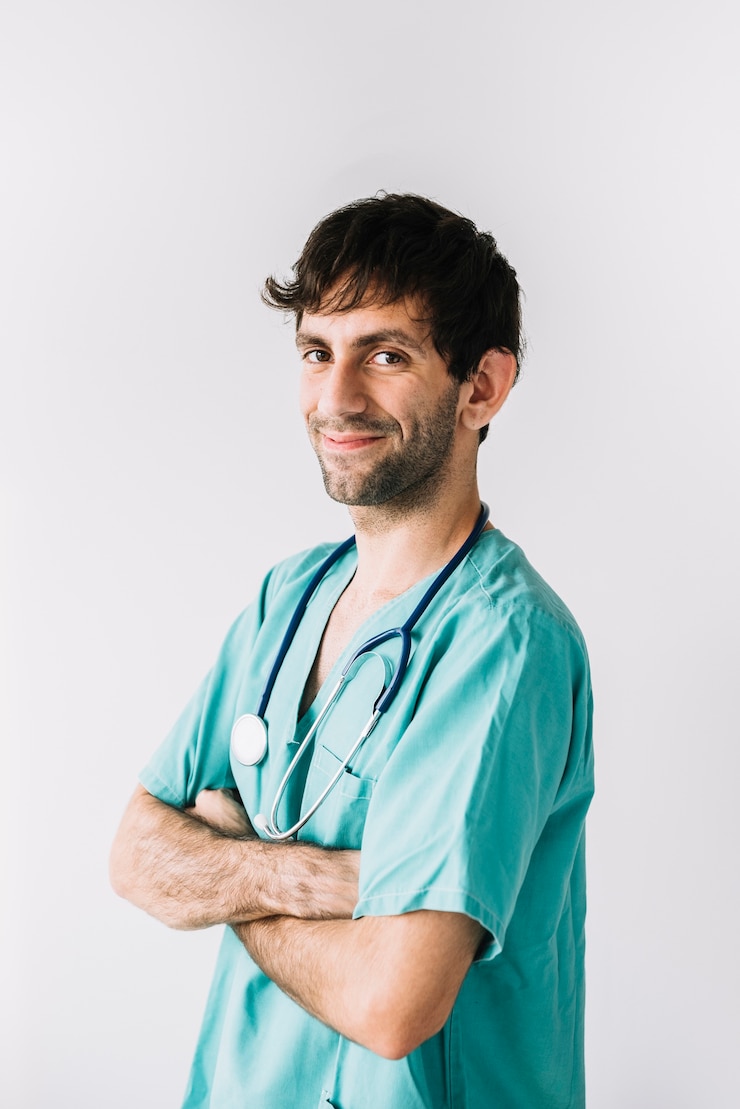 Free Photo portrait of a happy male doctor on white backdrop