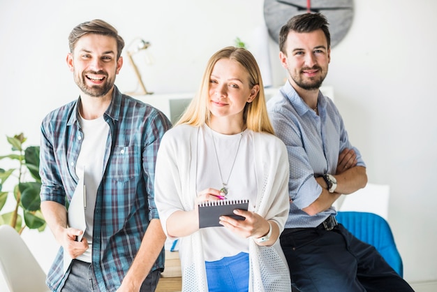 Portrait of happy male and female businesspeople