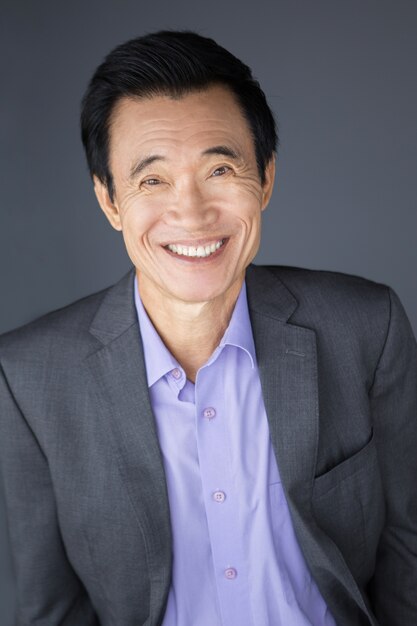Portrait of Happy Middle-aged Asian Businessman