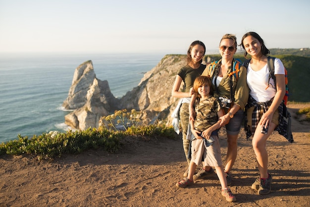 Free photo portrait of happy mother hiking with children