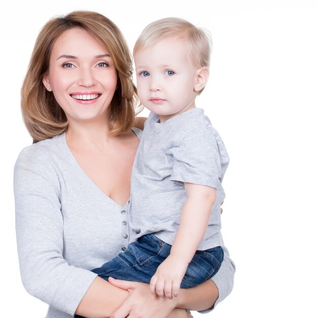 Portrait of happy mother with a small child - isolated on white