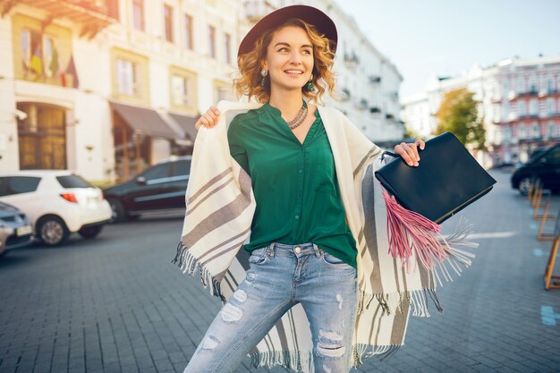 Portrait of happy positive woman smiling candid, spring fashion street style, wearing green blose