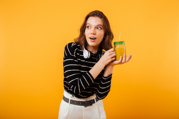 Portrait of a happy showing cocktail