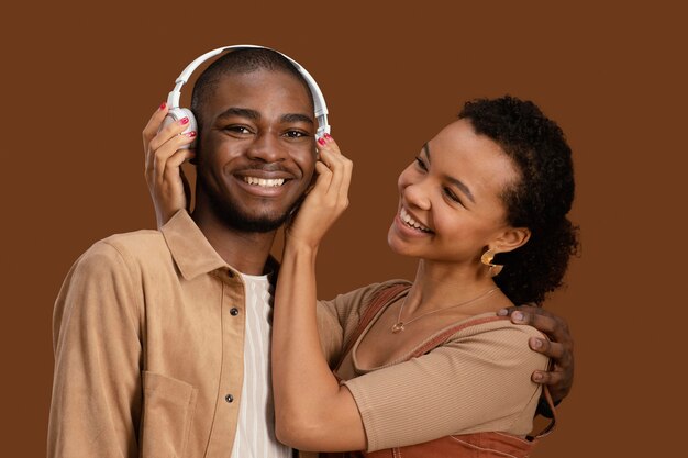Portrait of happy and smiley couple with headphones