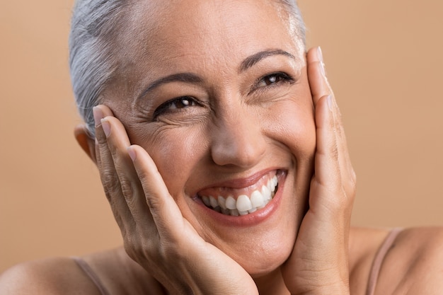 Portrait of happy smiley older woman