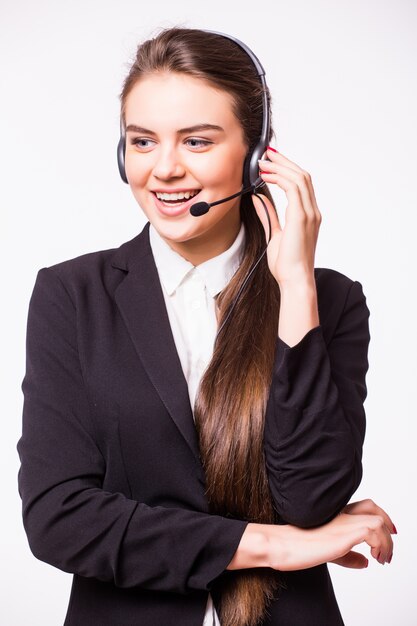 Portrait of happy smiling cheerful beautiful young customer support phone operator in headset, isolated over white wall