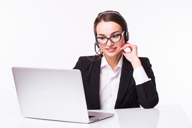 Portrait of happy smiling cheerful beautiful young support phone operator in headset with laptop, isolated over white wall