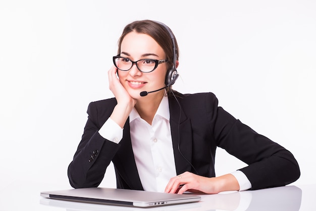 Portrait of happy smiling cheerful beautiful young support phone operator in headset with laptop, isolated over white wall