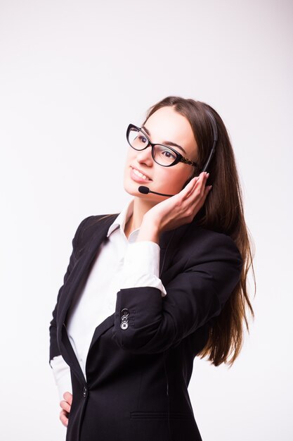 Portrait of happy smiling cheerful support phone operator in headset, isolated on white wall