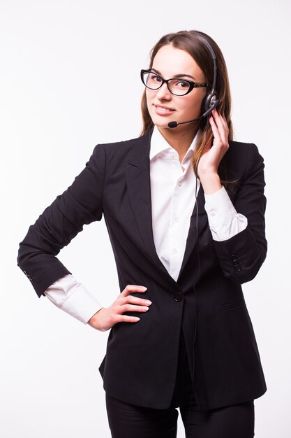 Portrait of happy smiling cheerful support phone operator in headset, isolated on white wall