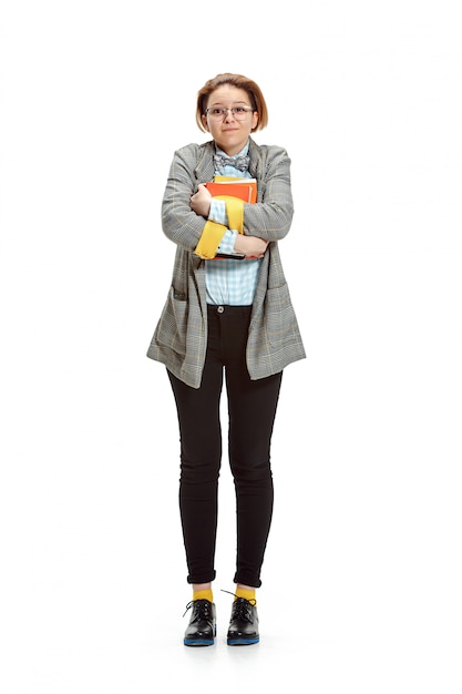 Free photo portrait of a happy smiling female student holding books isolated on white wall