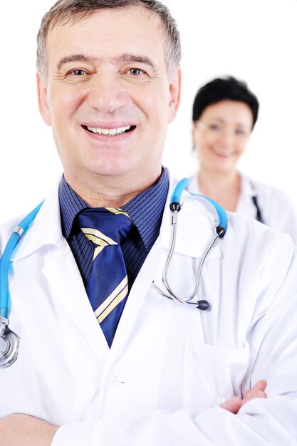 Portrait of happy smiling mature male doctor with female doctor