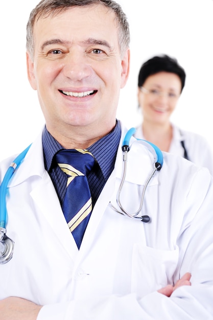Portrait of happy smiling mature male doctor with female doctor