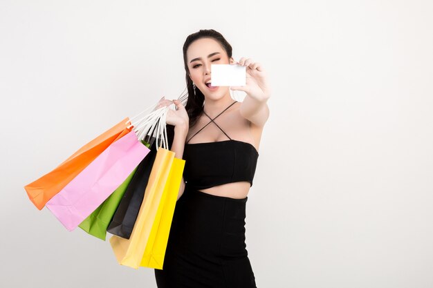 Portrait of happy smiling woman hold shopping bag